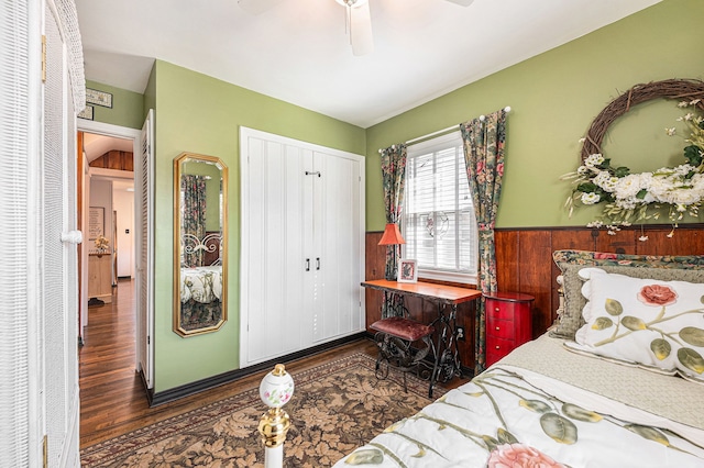 1107 E Lincoln Ave, Royal Oak, MI 48067 - bedroom featuring wood finished floors, wainscoting, a closet, and ceiling fan