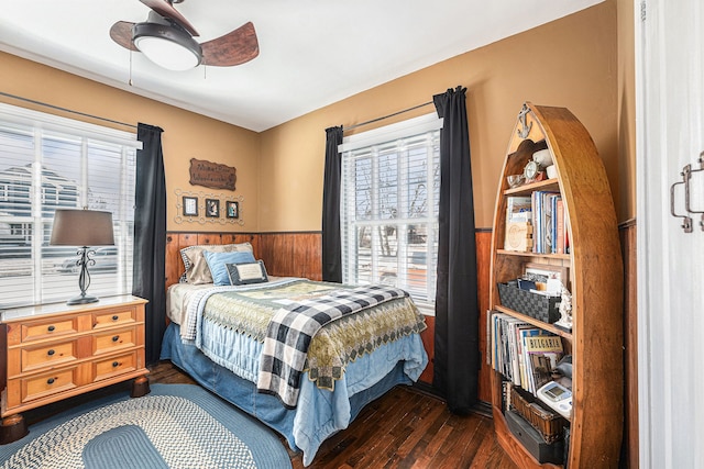 1107 E Lincoln Ave, Royal Oak, MI 48067 - bedroom featuring wainscoting, dark wood-style floors, wood walls, and ceiling fan