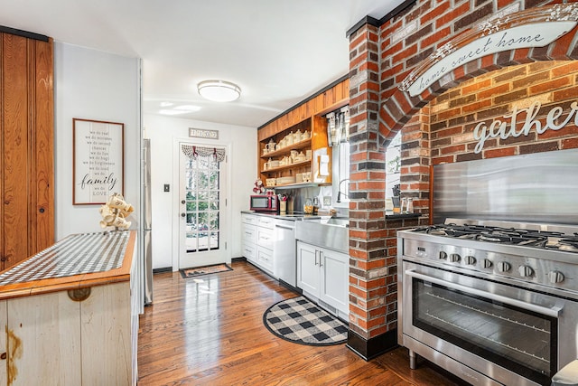 1107 E Lincoln Ave, Royal Oak, MI 48067 - kitchen featuring appliances with stainless steel finishes, wood finished floors, and open shelves