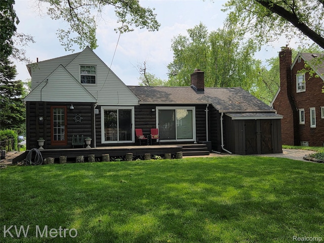 1107 E Lincoln Ave, Royal Oak, MI 48067 - rear view of property with a deck, a lawn, a chimney, and a shingled roof