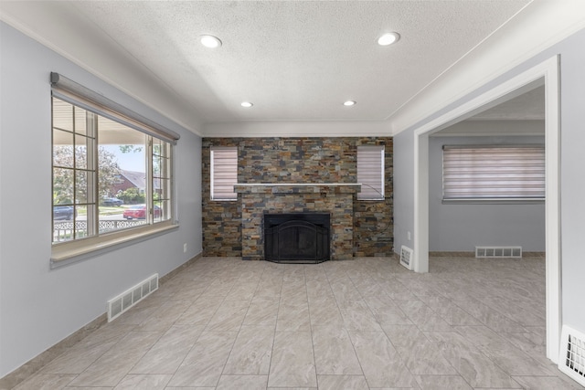 10436 Bertram St, Dearborn, MI 48126 - unfurnished living room featuring a textured ceiling, a fireplace, recessed lighting, and baseboards