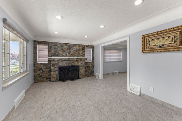 10436 Bertram St, Dearborn, MI 48126 - unfurnished living room featuring a textured ceiling, a large fireplace, recessed lighting, and baseboards