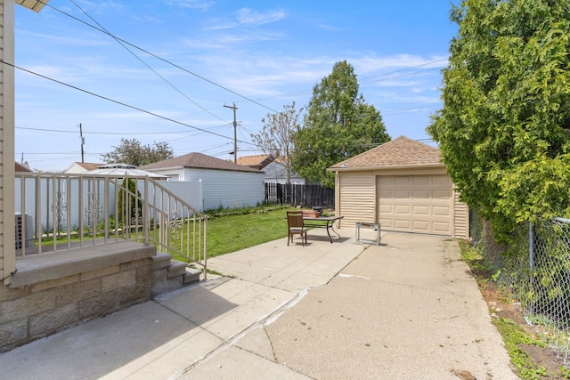 10436 Bertram St, Dearborn, MI 48126 - view of patio / terrace featuring an outdoor structure, a garage, a gazebo, driveway, and central AC unit