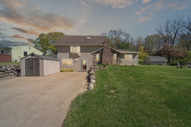 5780 Elvira, Pinckney, MI 48169 - view of front of house with a shed, an outbuilding, a chimney, and a lawn