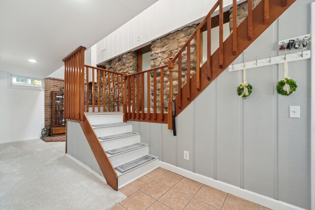 5780 Elvira, Pinckney, MI 48169 - stairs featuring baseboards, tile patterned floors, and a fireplace