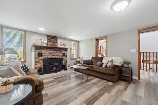 5780 Elvira, Pinckney, MI 48169 - living area with stairs, light wood finished floors, baseboards, and plenty of natural light