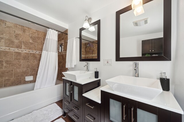 5780 Elvira, Pinckney, MI 48169 - bathroom with shower / bath combo, vanity, and wood finished floors