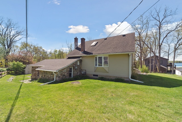 5780 Elvira, Pinckney, MI 48169 - rear view of house with a chimney, a yard, and roof with shingles