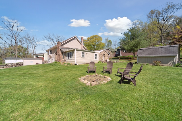 5780 Elvira, Pinckney, MI 48169 - view of grassy yard featuring an outbuilding and a storage shed