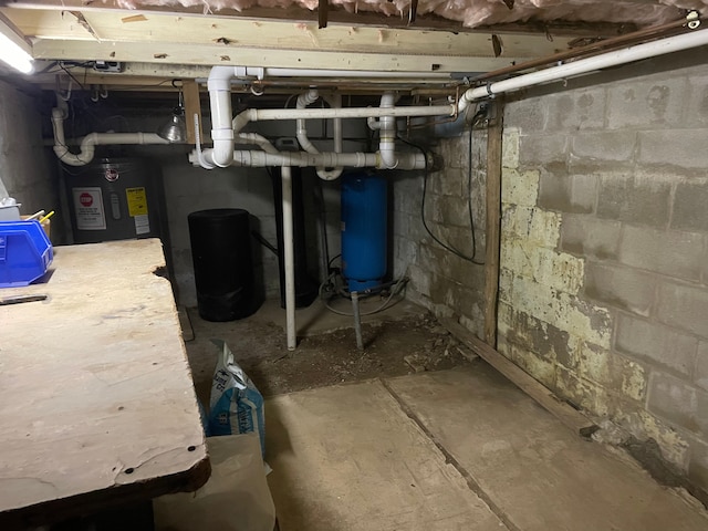 5780 Elvira, Pinckney, MI 48169 - unfinished basement with water heater and a water pressure tank