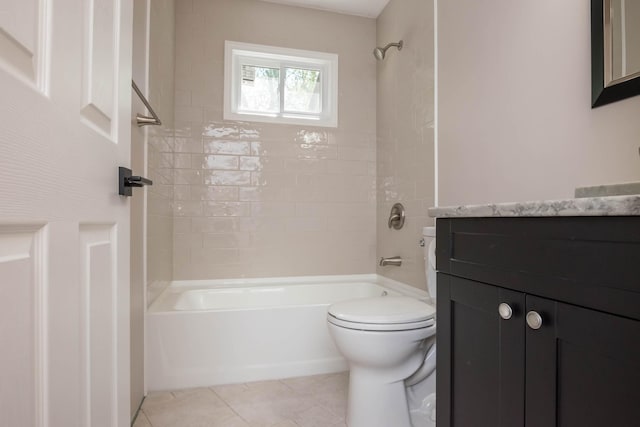 bathroom featuring toilet, bathtub / shower combination, vanity, and tile patterned floors