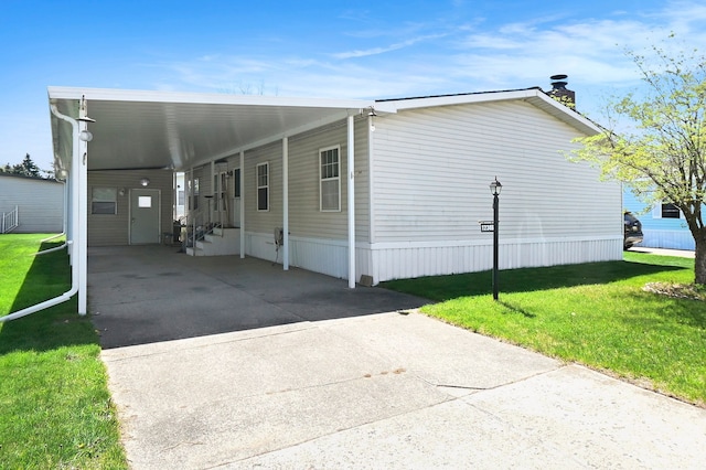 12346 Quail Ct, Shelby Twp, MI 48315 - view of front of house with concrete driveway, a front yard, an attached carport, and a chimney