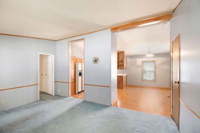 12346 Quail Ct, Shelby Twp, MI 48315 - unfurnished room with light carpet, ornamental molding, and vaulted ceiling