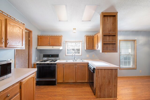 12346 Quail Ct, Shelby Twp, MI 48315 - kitchen with range with gas stovetop, a sink, stainless steel microwave, open shelves, and under cabinet range hood