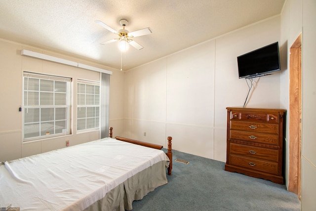 12346 Quail Ct, Shelby Twp, MI 48315 - carpeted bedroom featuring a ceiling fan and a textured ceiling