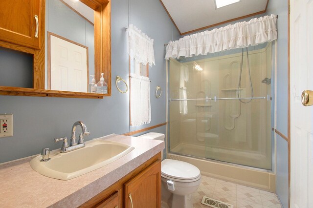 12346 Quail Ct, Shelby Twp, MI 48315 - full bathroom featuring a shower with door, toilet, and vanity