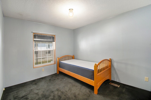 12346 Quail Ct, Shelby Twp, MI 48315 - bedroom featuring carpet flooring and a textured ceiling