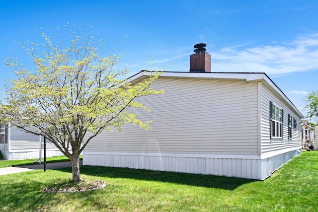 12346 Quail Ct, Shelby Twp, MI 48315 - view of home's exterior featuring a chimney and a lawn