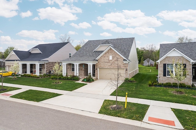4814 Cranston Rd Unit 86, Canton, MI 48188 - view of front facade featuring a front lawn, concrete driveway, brick siding, roof with shingles, and stone siding