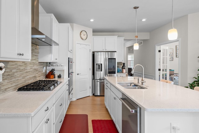 4814 Cranston Rd Unit 86, Canton, MI 48188 - kitchen featuring stainless steel appliances, wall chimney exhaust hood, a sink, white cabinets, and backsplash