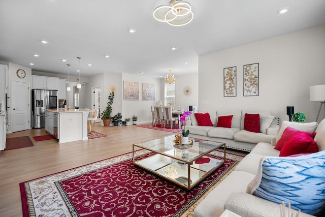 4814 Cranston Rd Unit 86, Canton, MI 48188 - living room featuring a chandelier, light wood-style floors, recessed lighting, and baseboards
