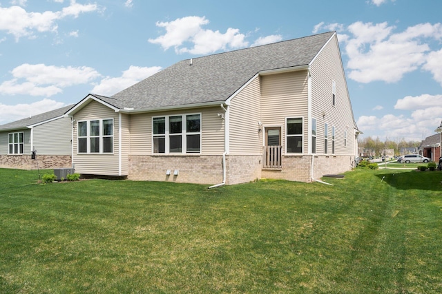4814 Cranston Rd Unit 86, Canton, MI 48188 - rear view of house with a lawn, roof with shingles, and brick siding