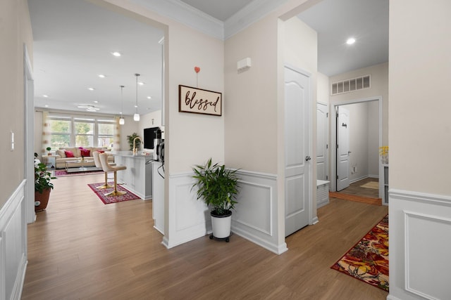 4814 Cranston Rd Unit 86, Canton, MI 48188 - hallway with wood finished floors, crown molding, recessed lighting, and a wainscoted wall