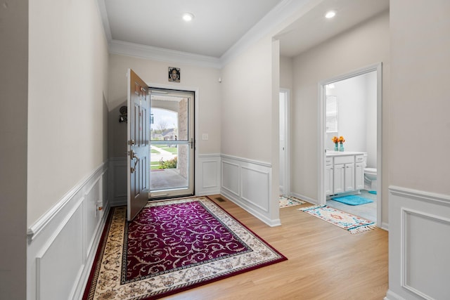 4814 Cranston Rd Unit 86, Canton, MI 48188 - doorway with light wood-style flooring, a wainscoted wall, crown molding, a decorative wall, and recessed lighting