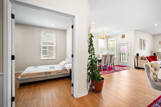 4814 Cranston Rd Unit 86, Canton, MI 48188 - bedroom featuring a chandelier, wood finished floors, access to outside, baseboards, and recessed lighting