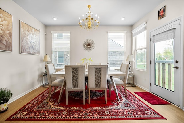 4814 Cranston Rd Unit 86, Canton, MI 48188 - dining area featuring a chandelier, baseboards, and wood finished floors
