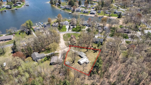 8607 Cochise Ct, Howard City, MI 49329 - aerial view of residential area with property boundaries highlighted and a large body of water