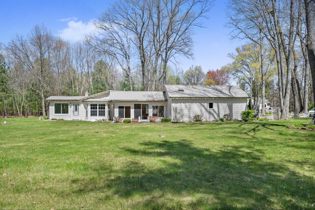 8607 Cochise Ct, Howard City, MI 49329 - rear view of property with a yard