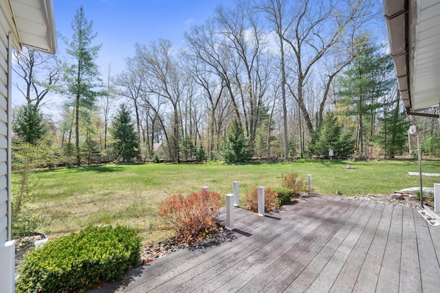 8607 Cochise Ct, Howard City, MI 49329 - wooden deck featuring a lawn