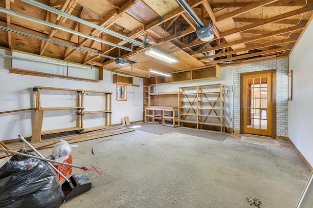 8607 Cochise Ct, Howard City, MI 49329 - garage featuring a garage door opener
