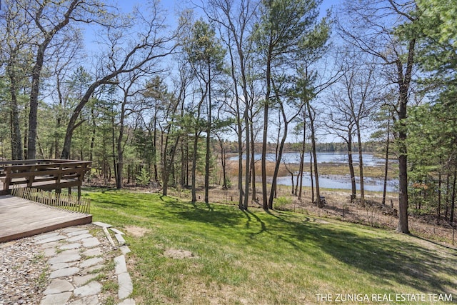 1087 Shore Walk Ln, Whitehall, MI 49461 - view of grassy yard featuring a deck with water view