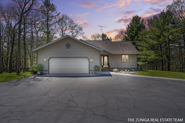 1087 Shore Walk Ln, Whitehall, MI 49461 - view of front of property with asphalt driveway and a garage