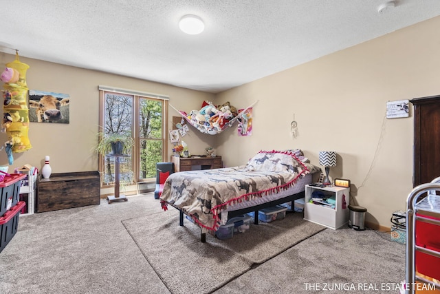 1087 Shore Walk Ln, Whitehall, MI 49461 - carpeted bedroom featuring a textured ceiling