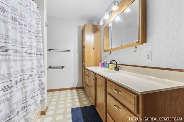 1087 Shore Walk Ln, Whitehall, MI 49461 - bathroom featuring tile patterned floors, vanity, curtained shower, and baseboards