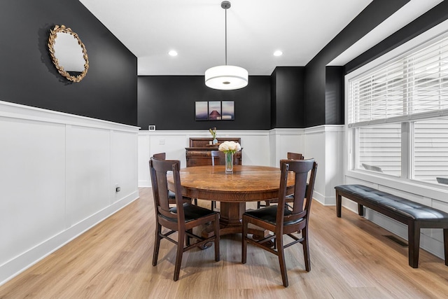 5414 Bradley Ct, Kalamazoo, MI 49009 - dining room with a decorative wall, light wood finished floors, wainscoting, and recessed lighting
