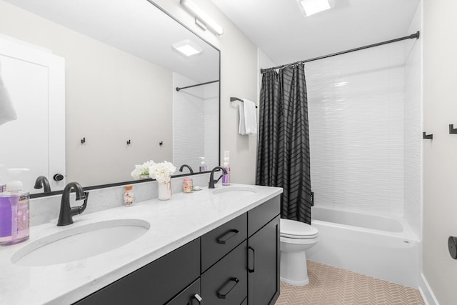 5414 Bradley Ct, Kalamazoo, MI 49009 - full bath featuring shower / bathtub combination with curtain, toilet, double vanity, and tile patterned floors