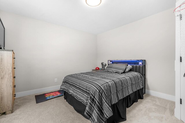 5414 Bradley Ct, Kalamazoo, MI 49009 - carpeted bedroom featuring baseboards