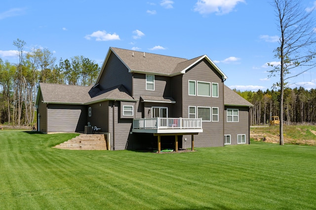 5414 Bradley Ct, Kalamazoo, MI 49009 - back of house featuring a deck, a yard, central AC, and roof with shingles