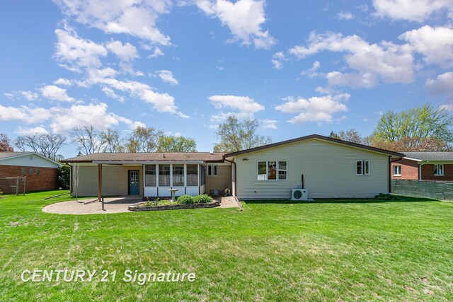 2936 Reppuhn Dr, Saginaw, MI 48603 - rear view of house with a sunroom and ac unit