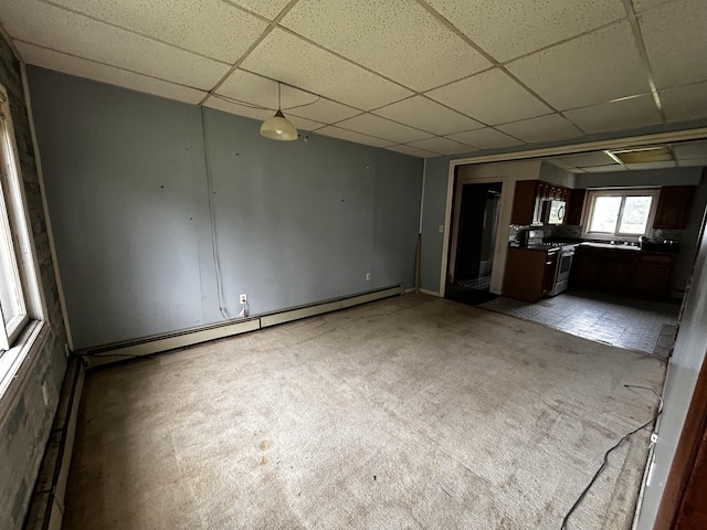 117 Hanover Ct, Hanover, MI 49241 - unfurnished living room with a paneled ceiling, a baseboard radiator, and light carpet