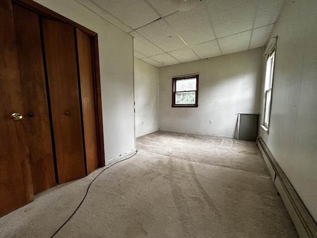 117 Hanover Ct, Hanover, MI 49241 - unfurnished bedroom with a drop ceiling, light colored carpet, and a baseboard radiator