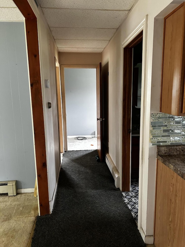 117 Hanover Ct, Hanover, MI 49241 - hall featuring carpet, baseboard heating, and a drop ceiling