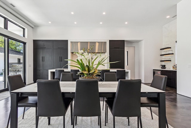 dining area featuring recessed lighting and concrete flooring