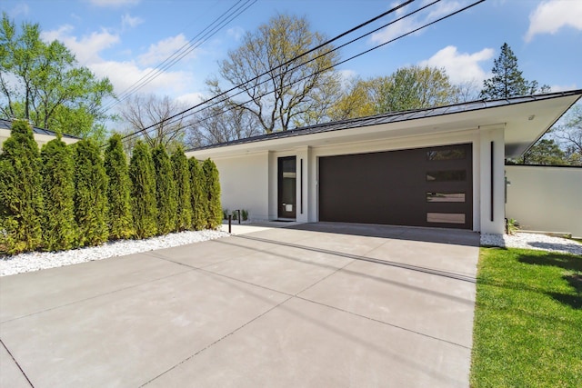 garage featuring driveway
