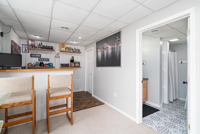 839 Rolling Meadows Dr, Quincy, MI 49082 - indoor dry bar featuring a drop ceiling, baseboards, and carpet floors