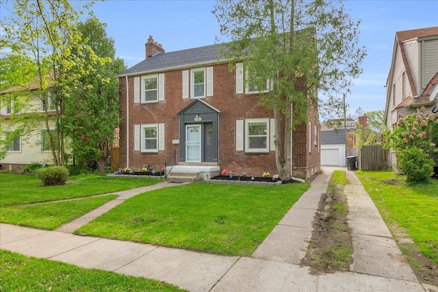 16585 Sunderland Rd, Detroit, MI 48219 - view of front of home with driveway, a chimney, brick siding, and a garage
